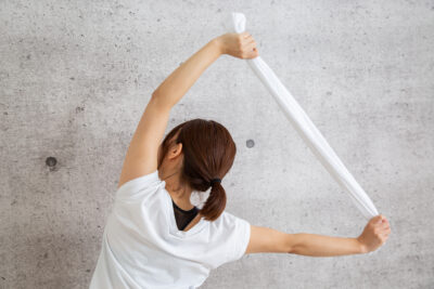 The,Woman,Who,Does,Stretch,Using,A,Towel