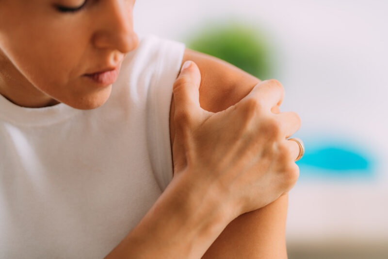 Woman,With,Shoulder,Pain.,Holding,Shoulder