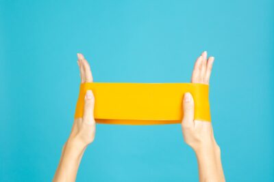 Closeup,Of,Caucasian,Female,Hands,With,Resistance,Band,Doing,Exercises